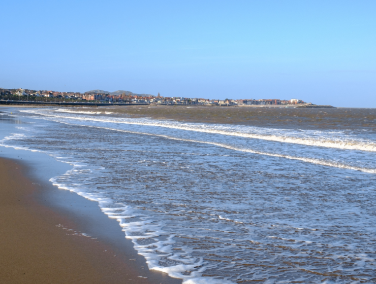Areal view of the beach on a sunny day in Colwyn bay, North Wales UK
